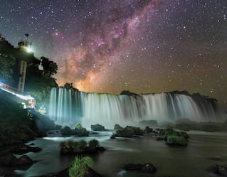 The night sky illuminated above the Iguassu Falls