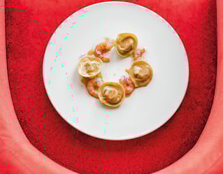 Basil and Pecorino tortelli with prawns and tomato